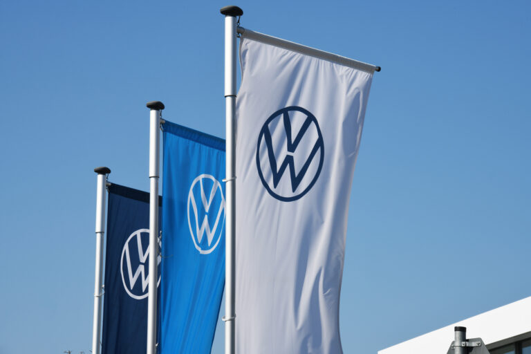 Hanover, lower saxony / germany april 5, 2020: flags with the new logo of ag in hanover, germany is one of the world's leading manufacturers of automobiles