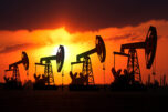 Oil donkey derrick sunset