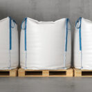 Three large white sacks on a pallet. 3d render